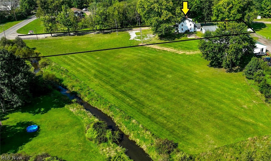 *A DRONE VIEW OF ESTIMATE OF LAND. NOTE THE GORGEOUS OPEN LAND BESIDE IT OWNED BY A BUSINESS BEHIND IT, THAT DOES NOT GET USED ~