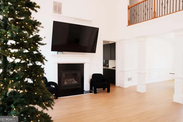 a living room with a flat screen tv and a fireplace