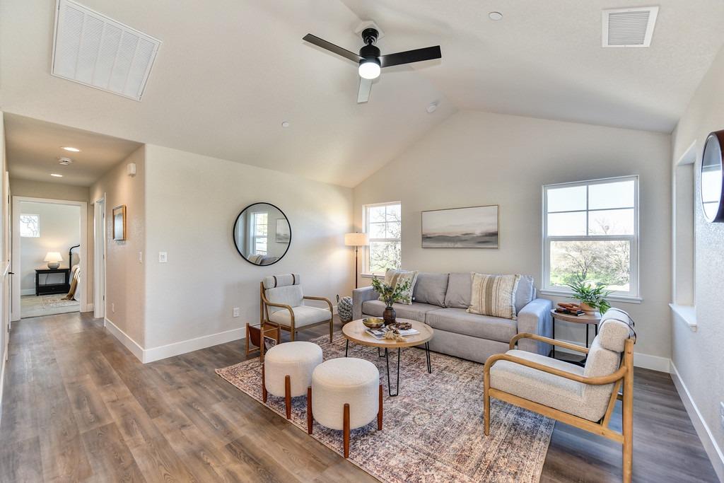2660 Commons Place Auburn, CA 95603 - Photo 11 of 55 a living room with furniture a window and a chandelier