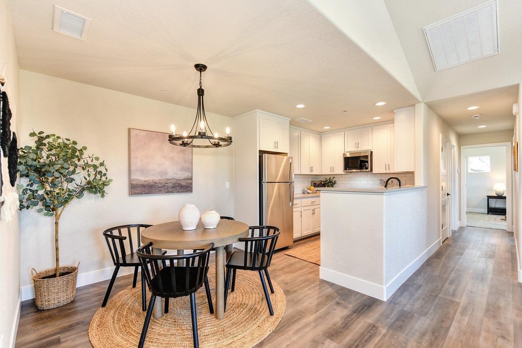 2660 Commons Place Auburn, CA 95603 - Photo 15 of 55 a view of a dining room with furniture and wooden floor