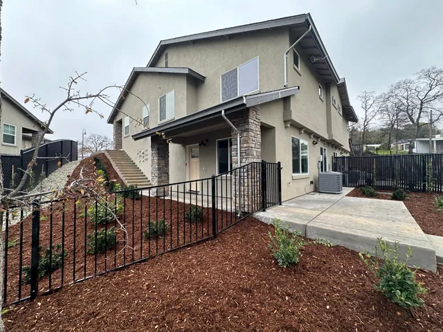 a view of a house with wooden deck