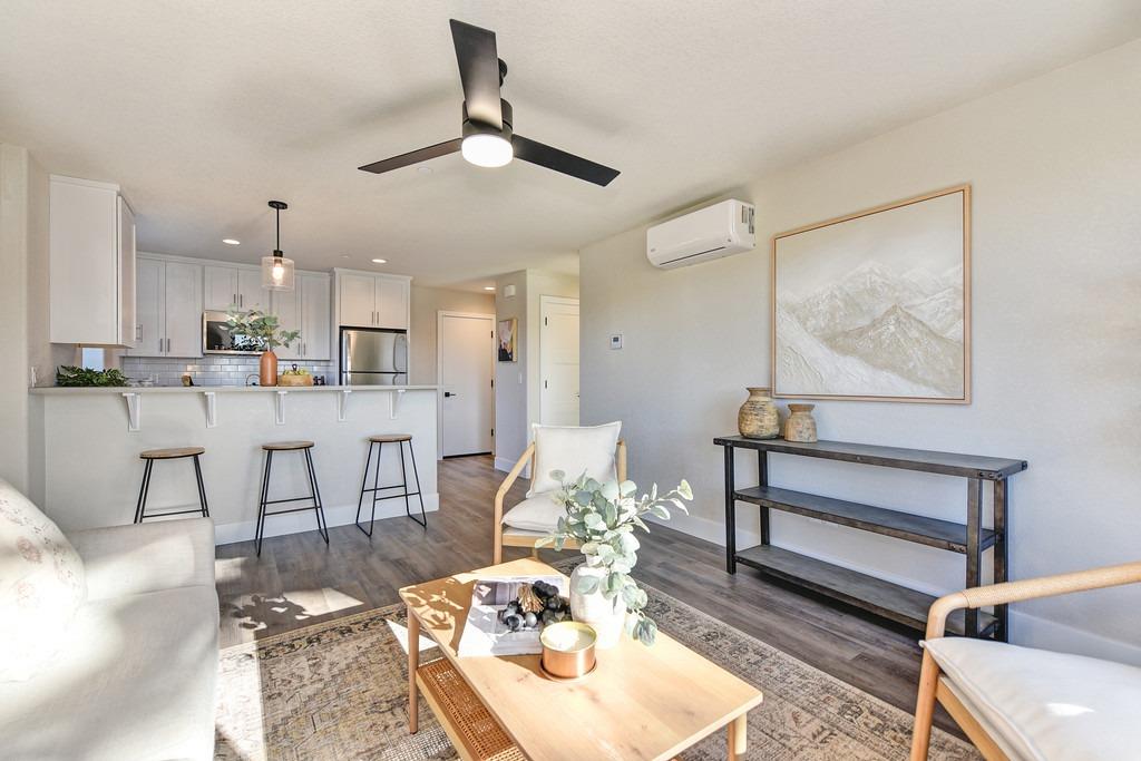 2660 Commons Place Auburn, CA 95603 - Photo 38 of 55 a living room with stainless steel appliances kitchen island granite countertop furniture and a rug