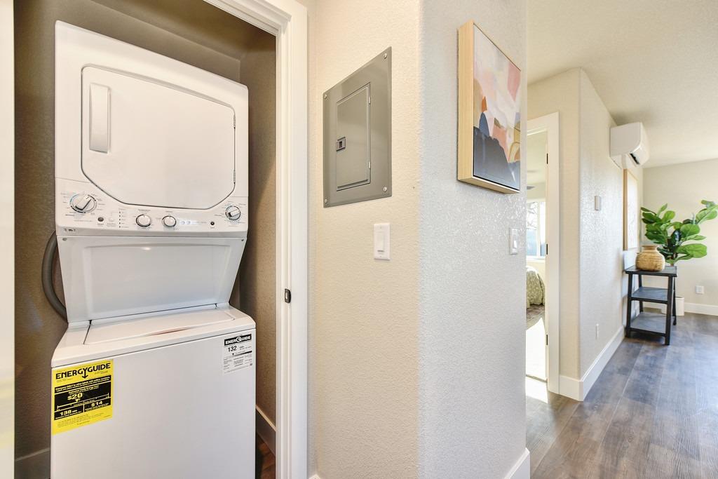 2660 Commons Place Auburn, CA 95603 - Photo 49 of 55 a view of a hallway with wooden floor and a washer and dryer