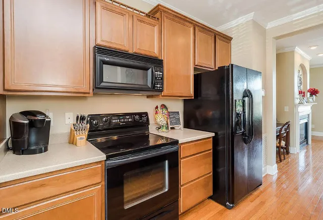 a kitchen with a refrigerator stove and microwave