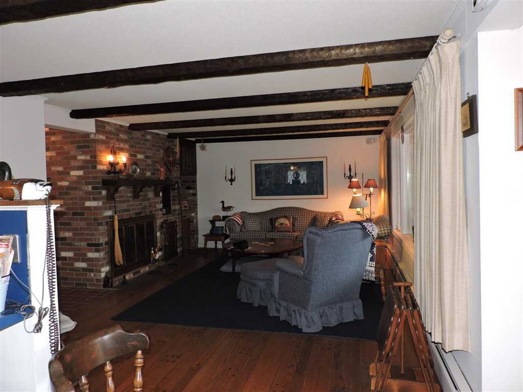 46 Point Pleasant Road Webster, MA 01570 - Photo 13 of 30 a living room with furniture and a fireplace