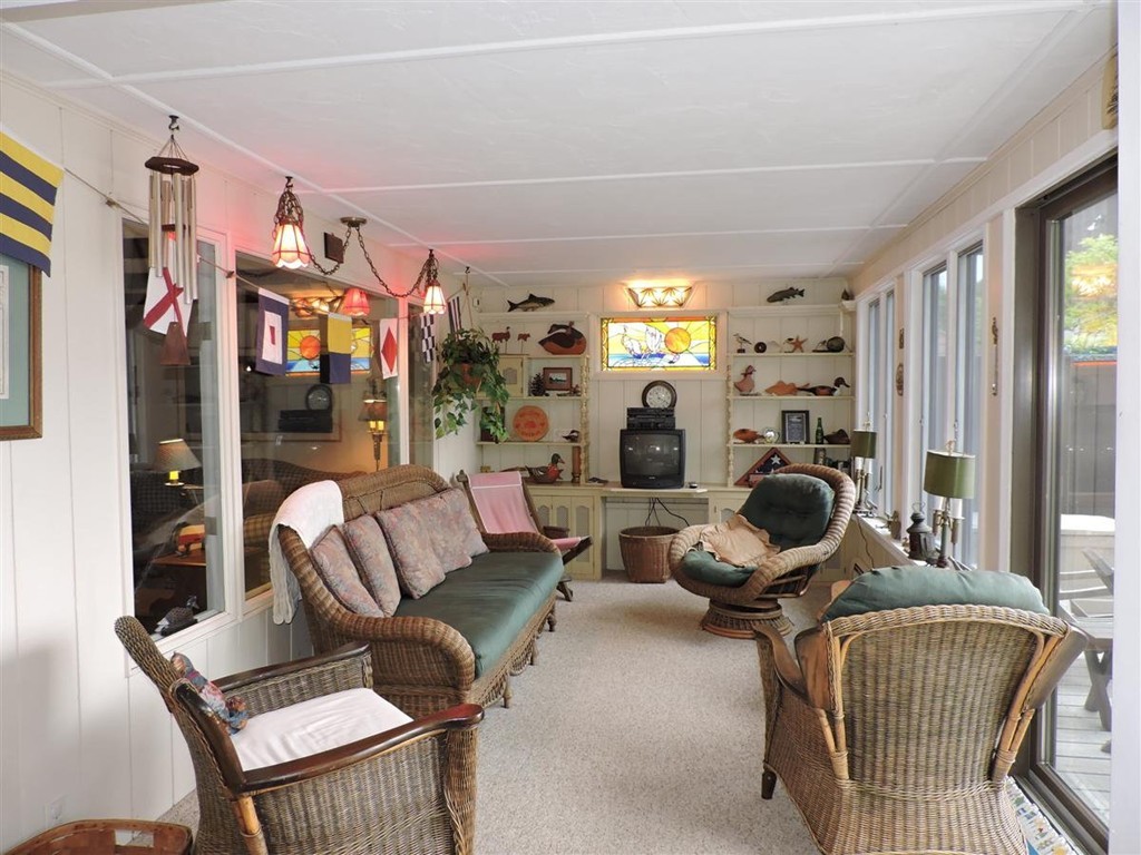 46 Point Pleasant Road Webster, MA 01570 - Photo 17 of 30 a living room with furniture a lamp and large window