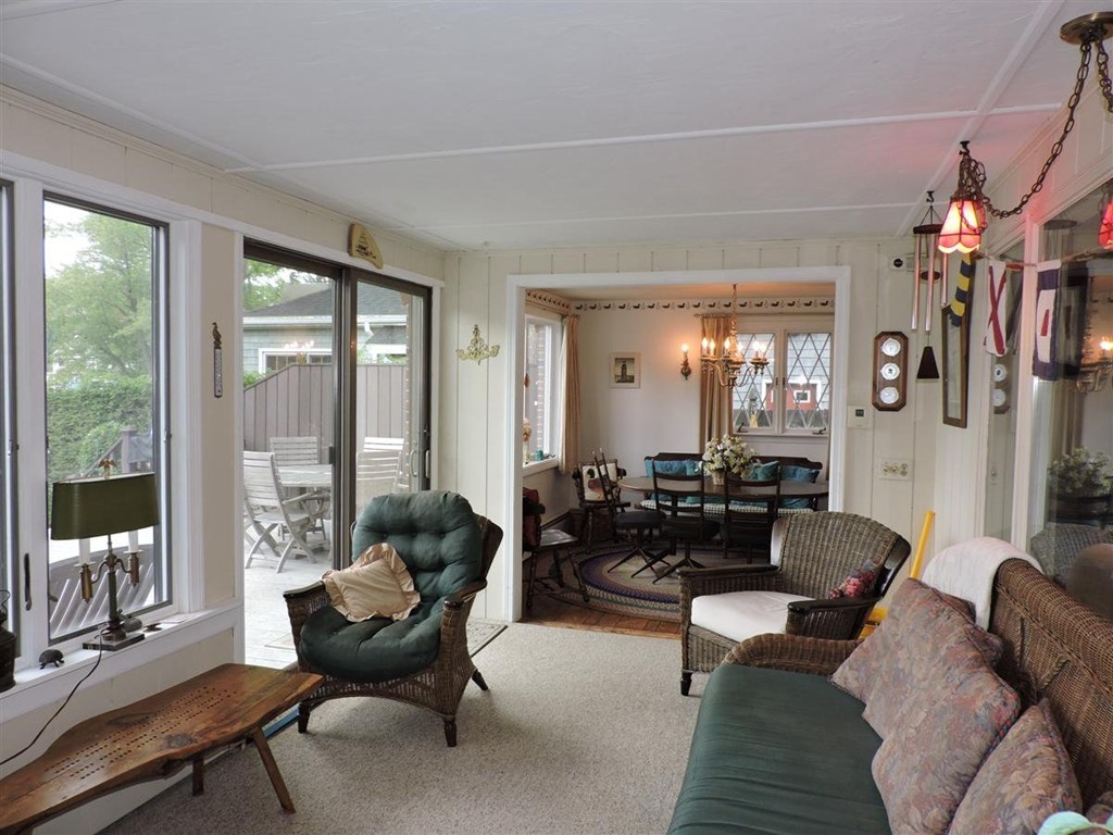 46 Point Pleasant Road Webster, MA 01570 - Photo 18 of 30 a living room with furniture a lamp a rug and a large window