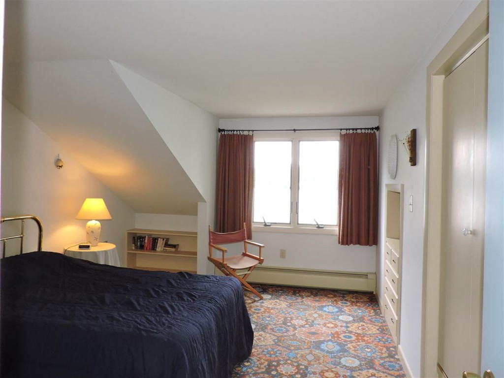 46 Point Pleasant Road Webster, MA 01570 - Photo 25 of 30 a bedroom with a bed and a window