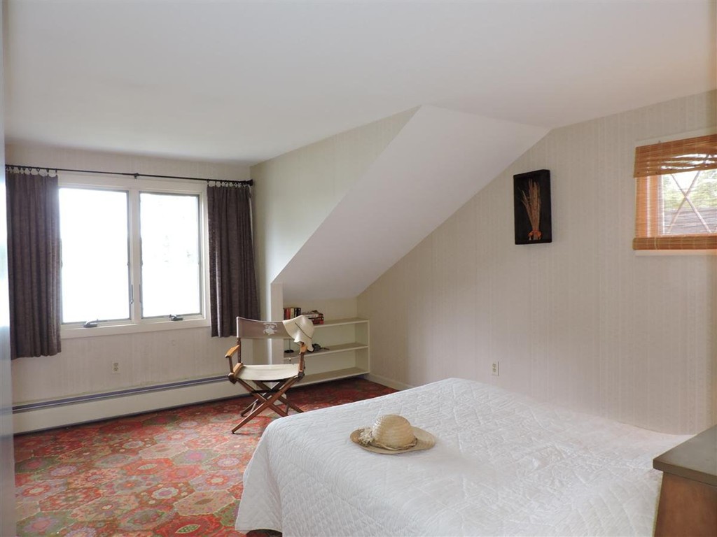 46 Point Pleasant Road Webster, MA 01570 - Photo 27 of 30 a bedroom with a bed and window
