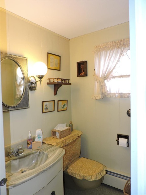 46 Point Pleasant Road Webster, MA 01570 - Photo 29 of 30 a bathroom with a toilet sink and mirror