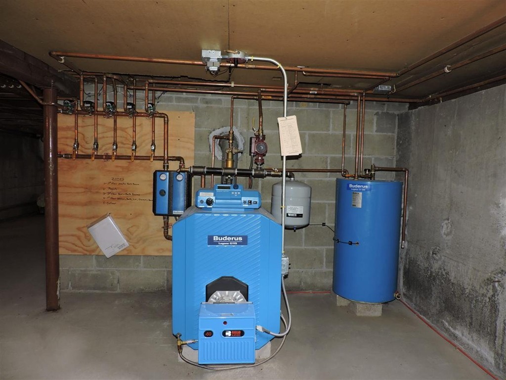 46 Point Pleasant Road Webster, MA 01570 - Photo 30 of 30 a utility room with a wooden floor