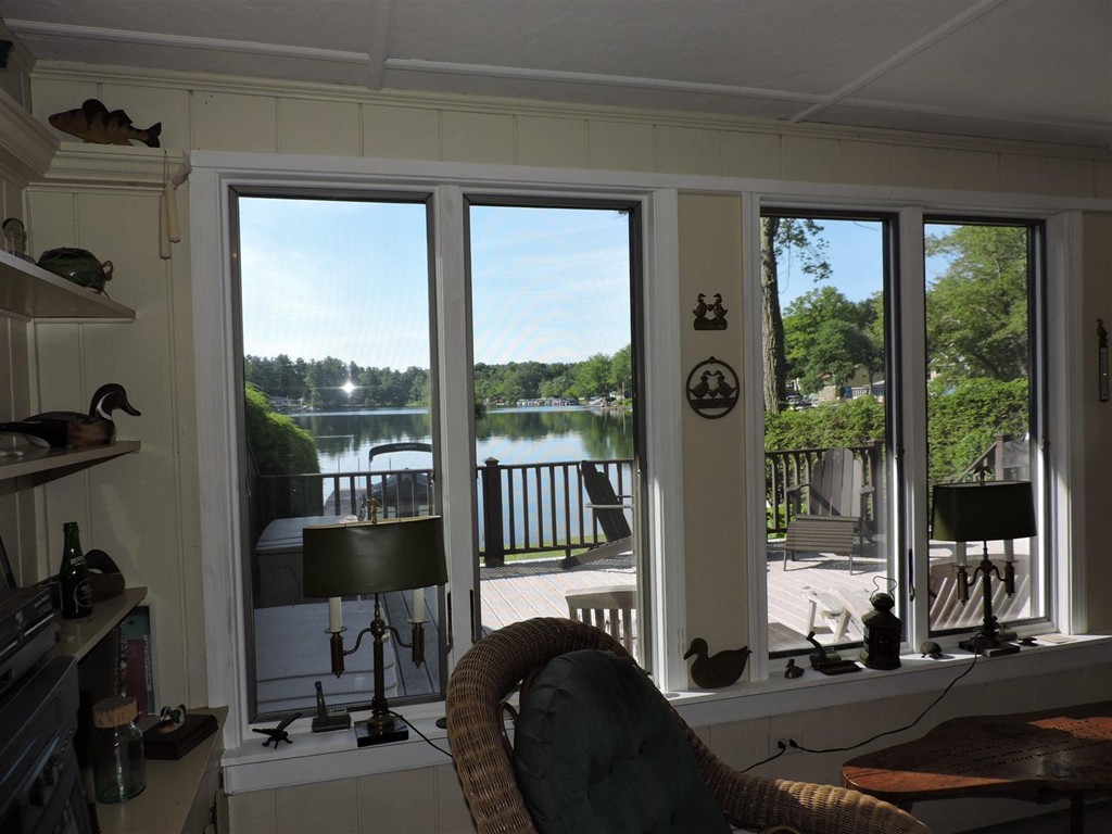46 Point Pleasant Road Webster, MA 01570 - Photo 4 of 30 a living room with furniture and a floor to ceiling window