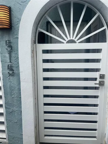 a view of a hallway with washer and dryer