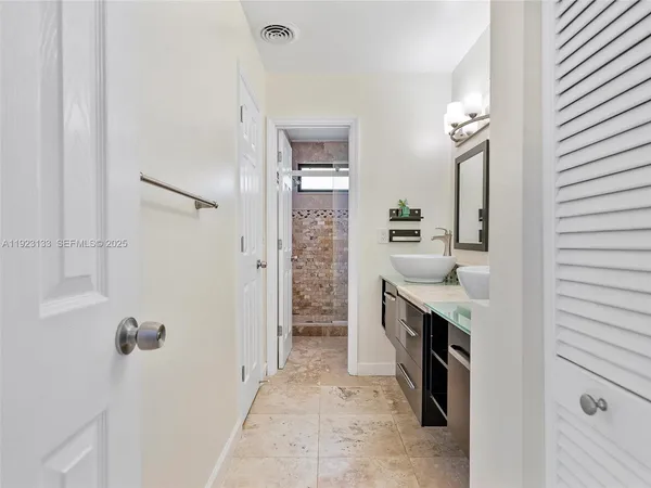 a kitchen with stainless steel appliances a stove sink and microwave