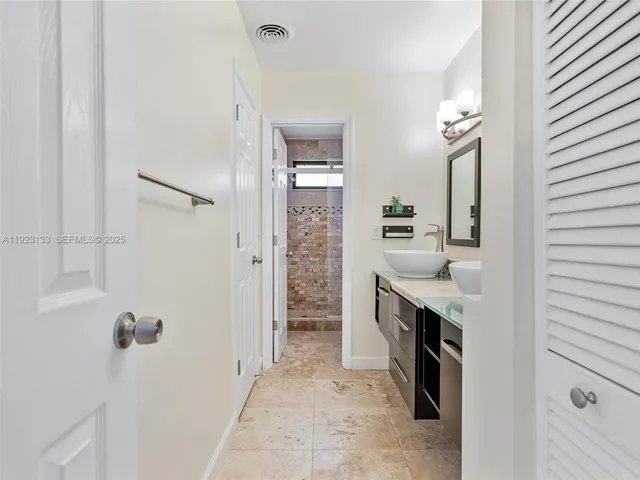 a kitchen with stainless steel appliances a stove sink and microwave