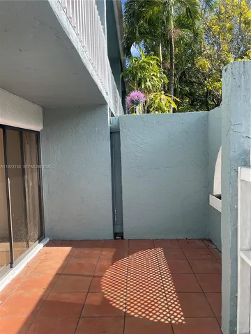 a bedroom with a bed and sliding door