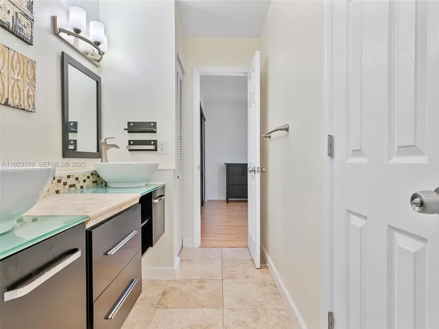 a spacious bedroom with a bed and window