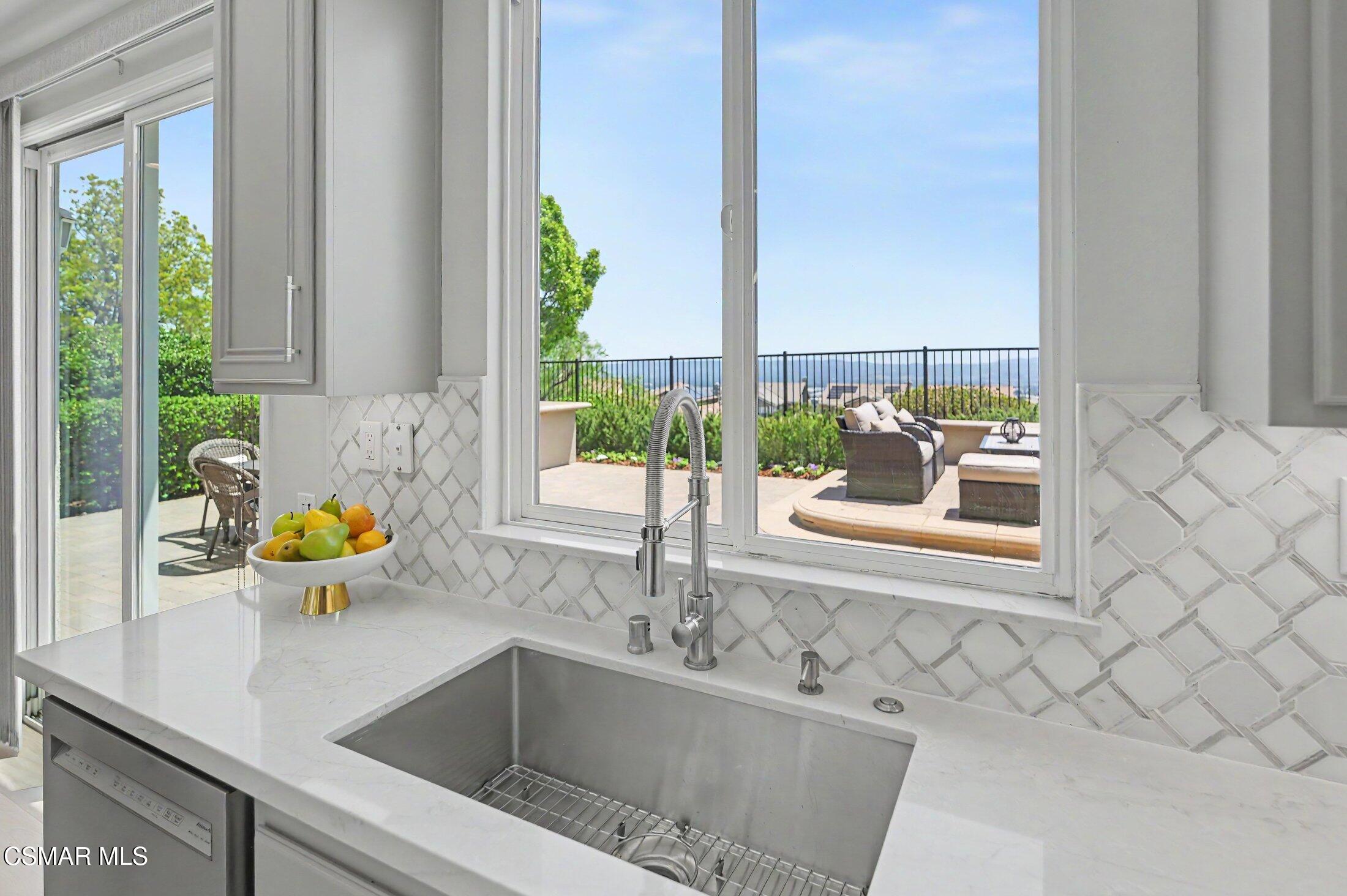 20800 Sardinia Way Porter Ranch, CA 91326 - Photo 13 of 57 a kitchen with a sink and a window