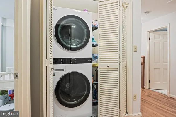 a view of a hallway with washer and dryer