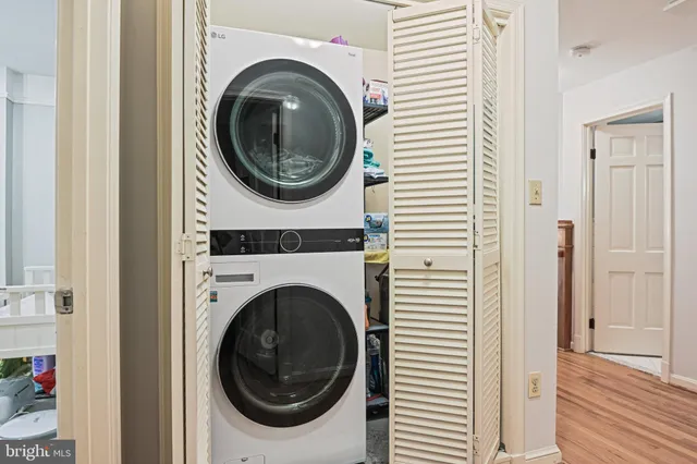 a view of a hallway with washer and dryer
