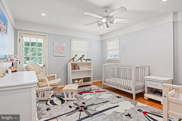 a bedroom with furniture and a chandelier