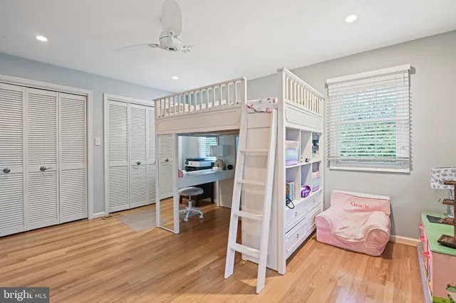 a very nice looking room with wooden floor and a window