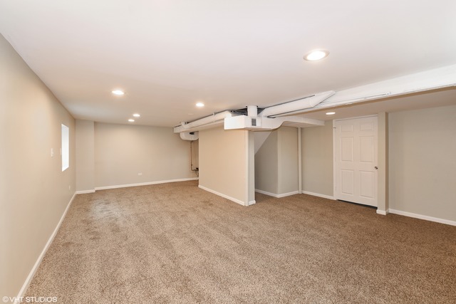 1915 Herbert Avenue Berkeley, IL 60163 - Photo 5 of 10 an empty room with a empty space and windows