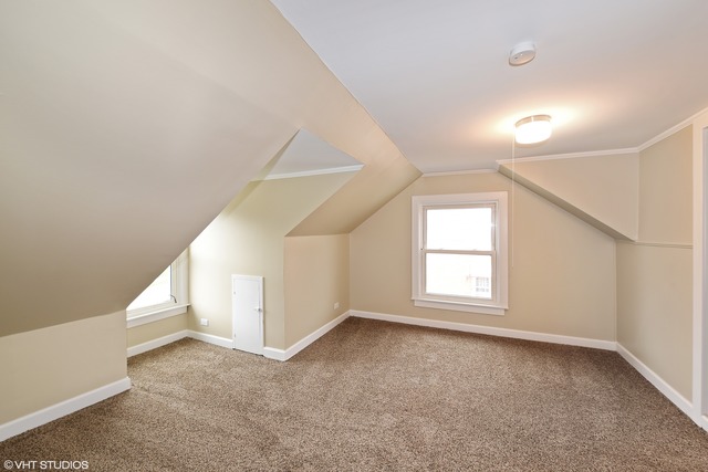 1915 Herbert Avenue Berkeley, IL 60163 - Photo 6 of 10 an empty room with windows