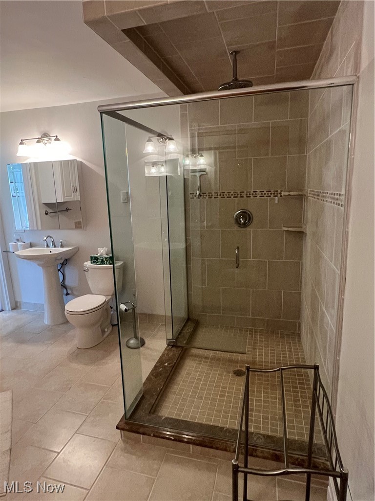 6171 Barrett Road Geneva, OH 44041 - Photo 34 of 38 Bathroom featuring a shower stall and light tile patterned floors