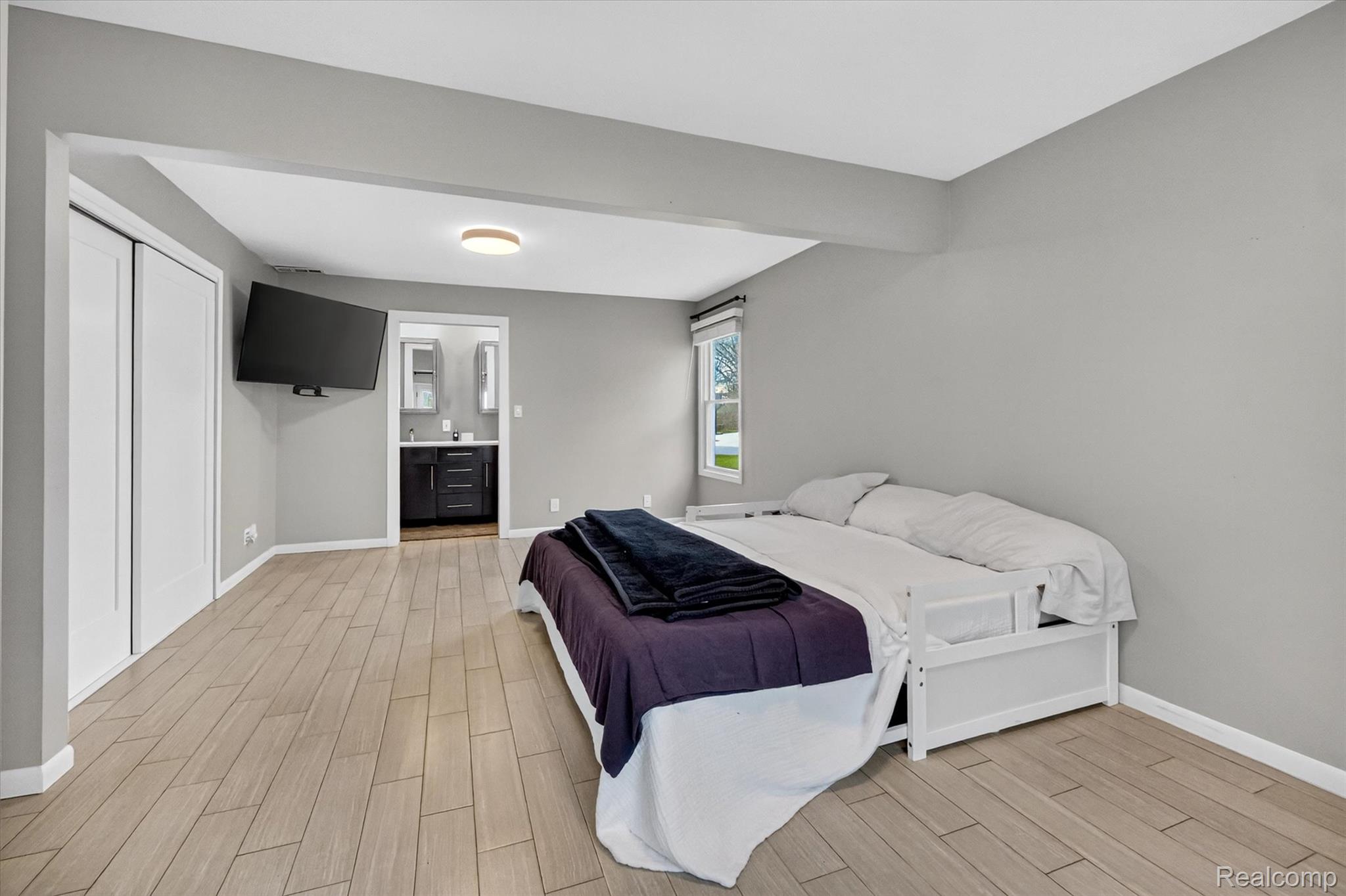2264 Crane Road Fenton, MI 48430 - Photo 28 of 55 Bedroom with wood finish floors and ensuite bath