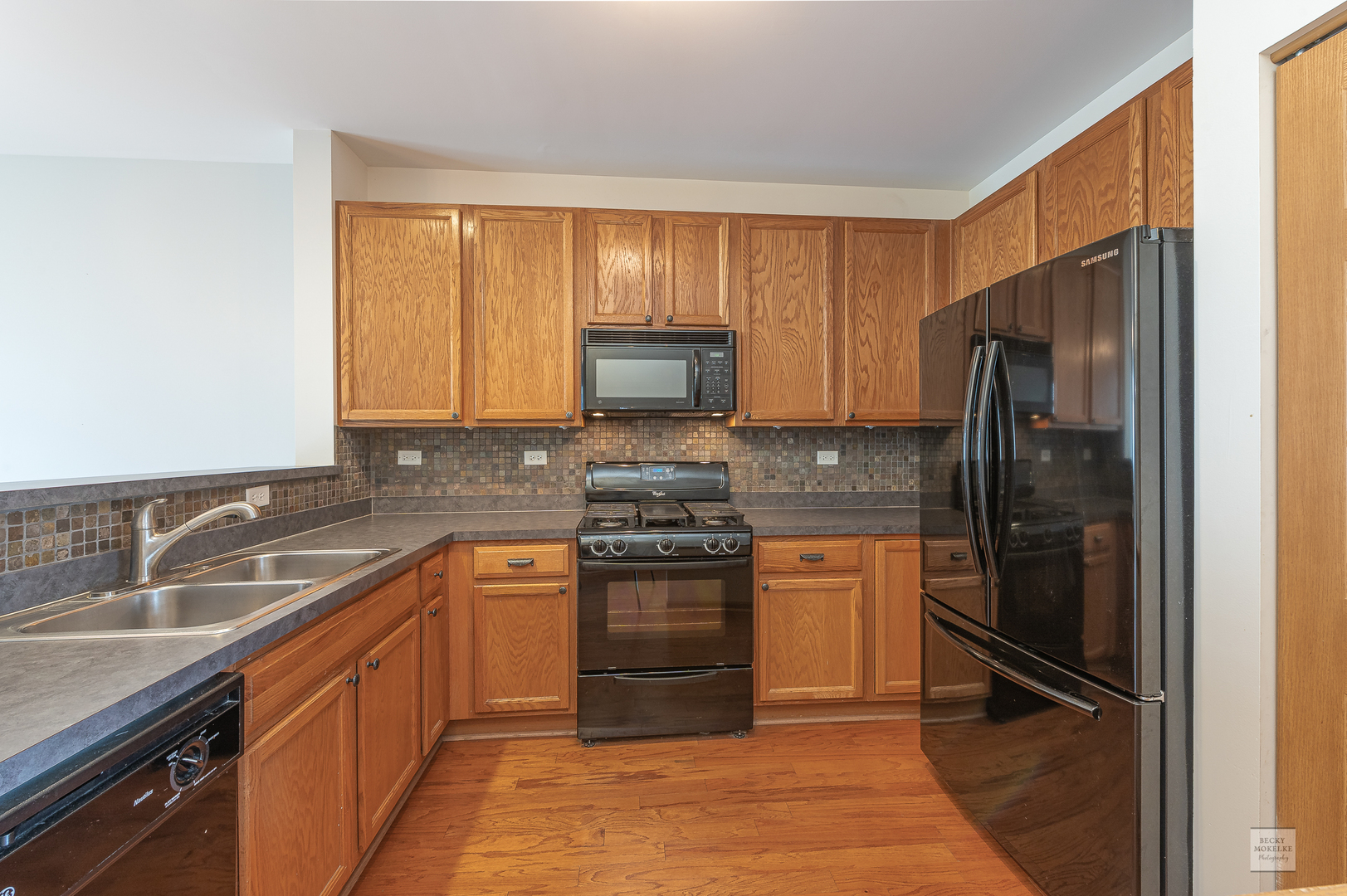 2510 Golf Ridge Circle Naperville, IL 60563 - Photo 2 of 10 a kitchen with a sink stove and refrigerator