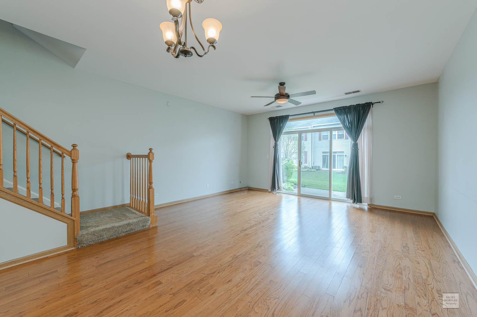 2510 Golf Ridge Circle Naperville, IL 60563 - Photo 4 of 10 a view of an empty room with wooden floor and a window