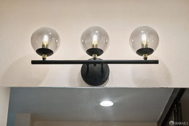 a view of a room with wooden floor and cabinet