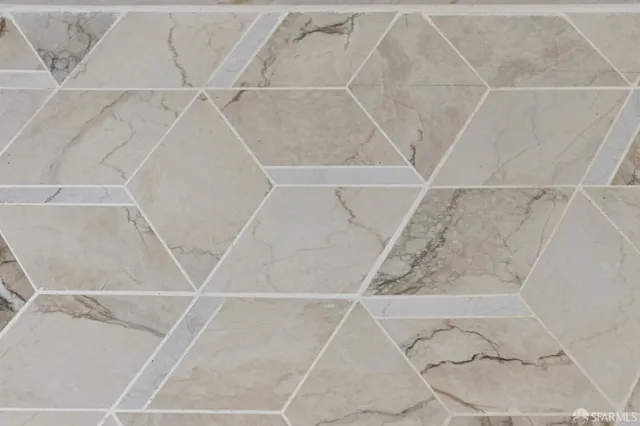 a bathroom with a shower sink and mirror