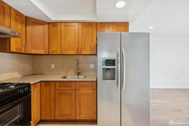 a view of a house with wooden fence