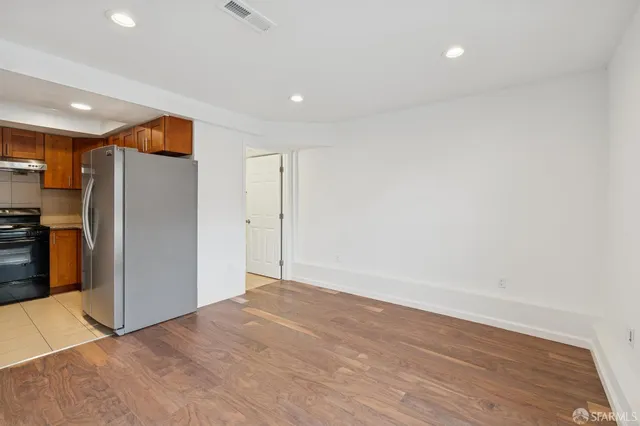 an aerial view of residential houses with buildings