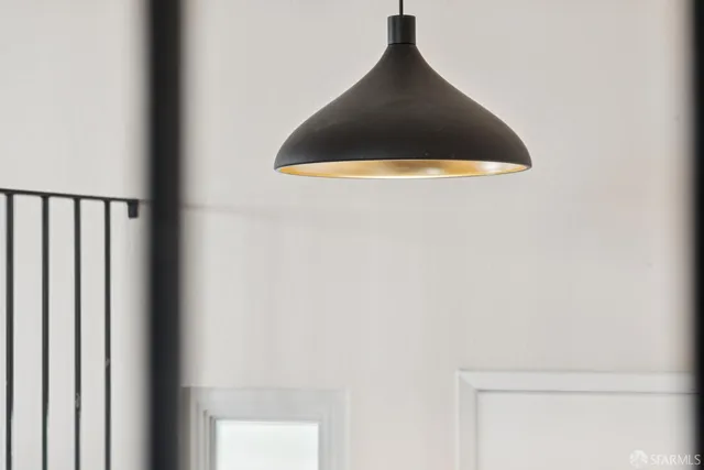 a view of a kitchen with a sink and a large window