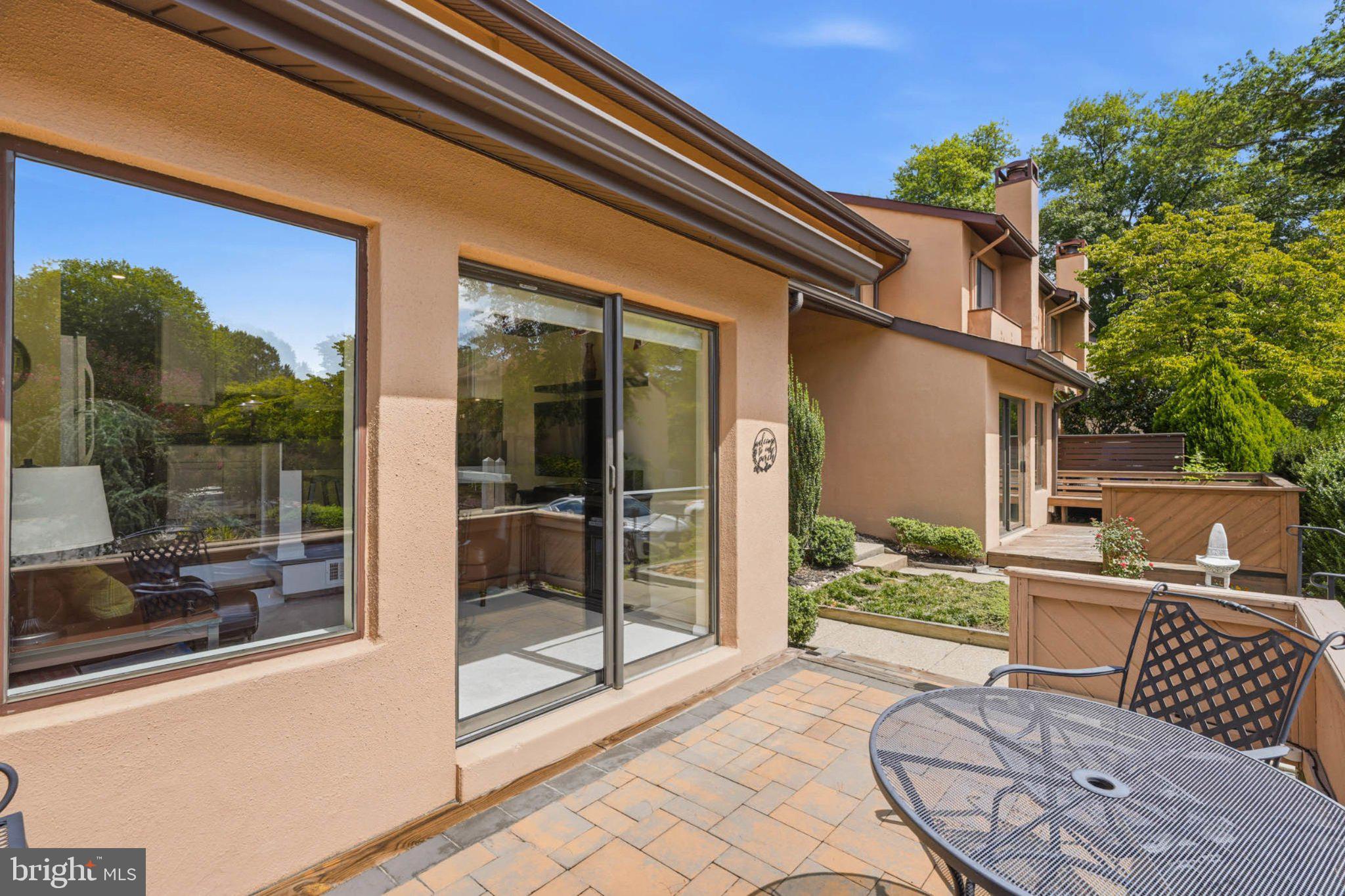 5610 Vantage Point Road Columbia, MD 21044 - Photo 15 of 28 Sunny patio with lush greenery.