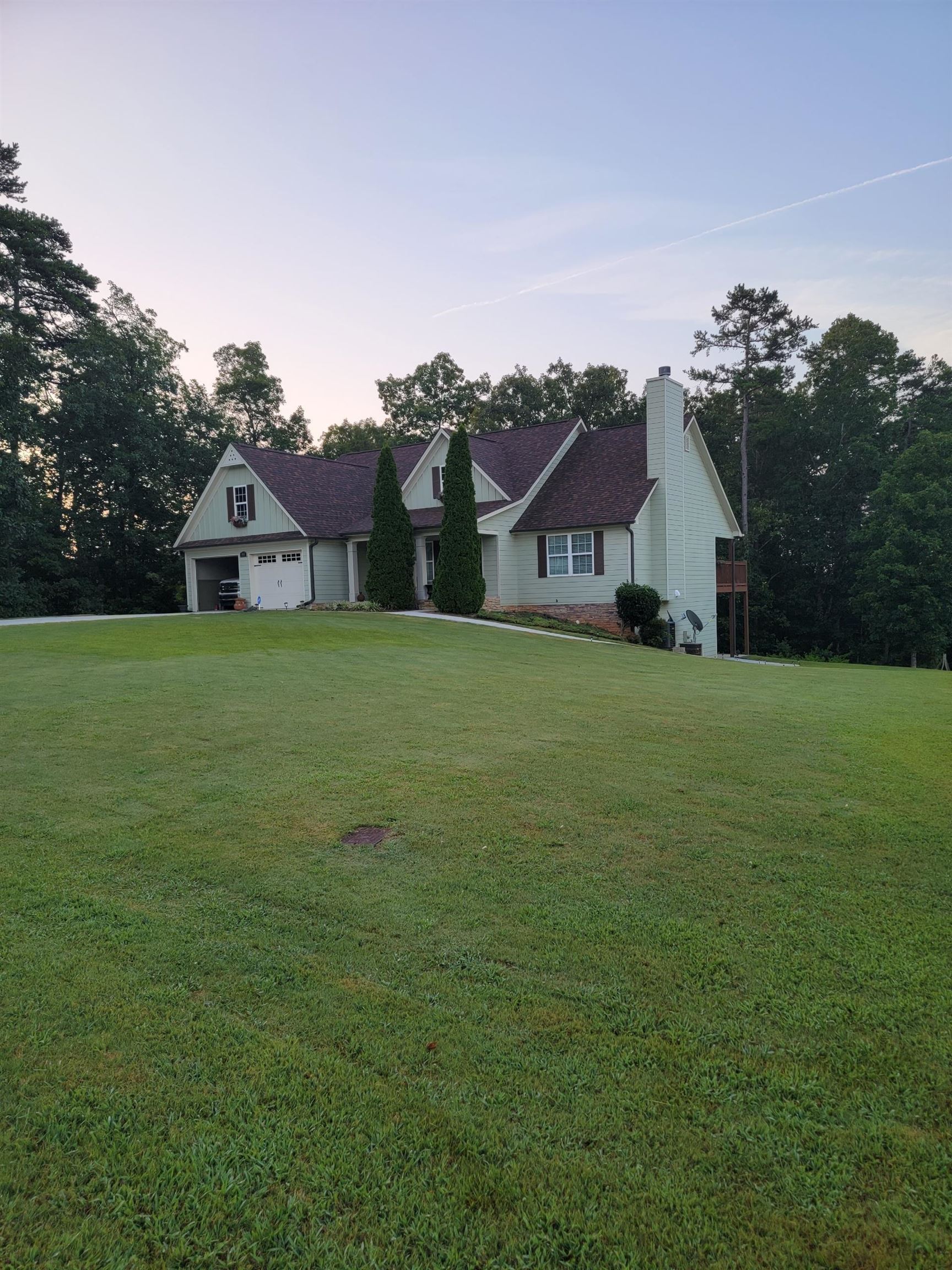 865 Simonton Road Southwest Lawrenceville, GA 30045 - Photo 1 of 1 a front view of a house with a yard