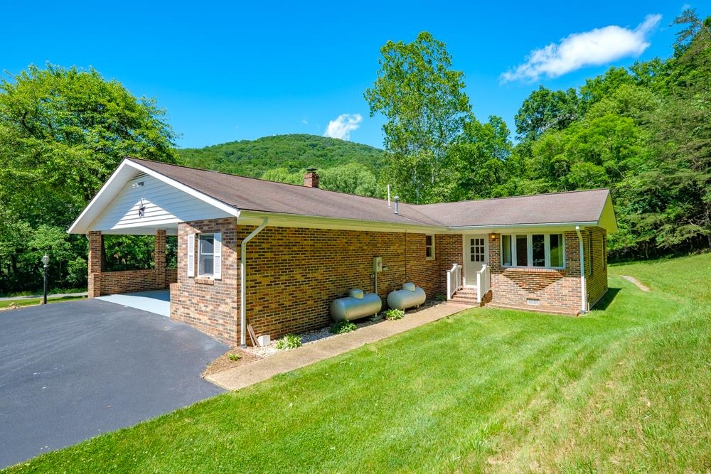 20982 Bennett Run Road Bergton, VA 22811 - Photo 34 of 54 front view of a house with a yard