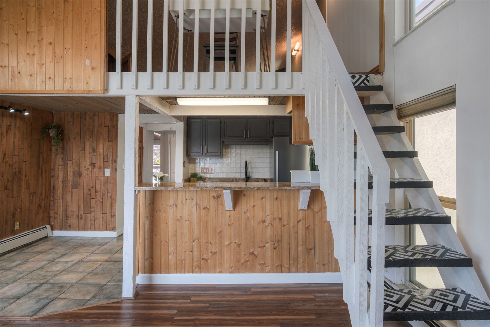 7031 Ryan Gulch Road, Unit 301 Silverthorne, CO 80498 - Photo 14 of 37 a view of entryway and hall with wooden floor