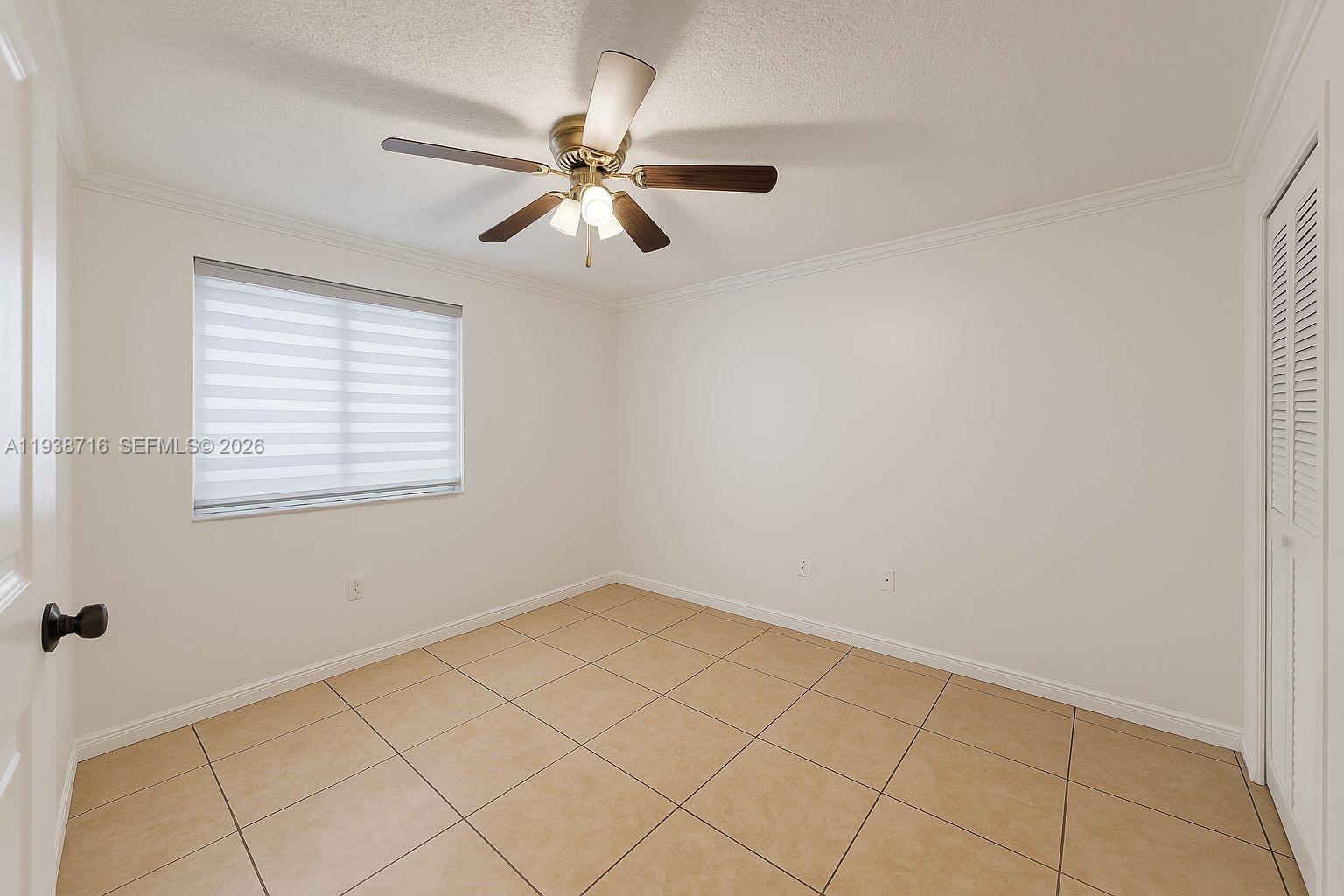 8170 Northwest 10th Street, Unit 2 Miami, FL 33126 - Photo 6 of 10 a view of an empty room with a window