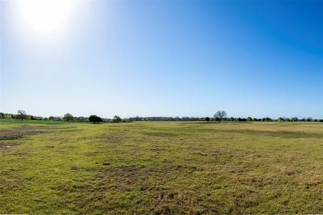 a view of an ocean and sunset