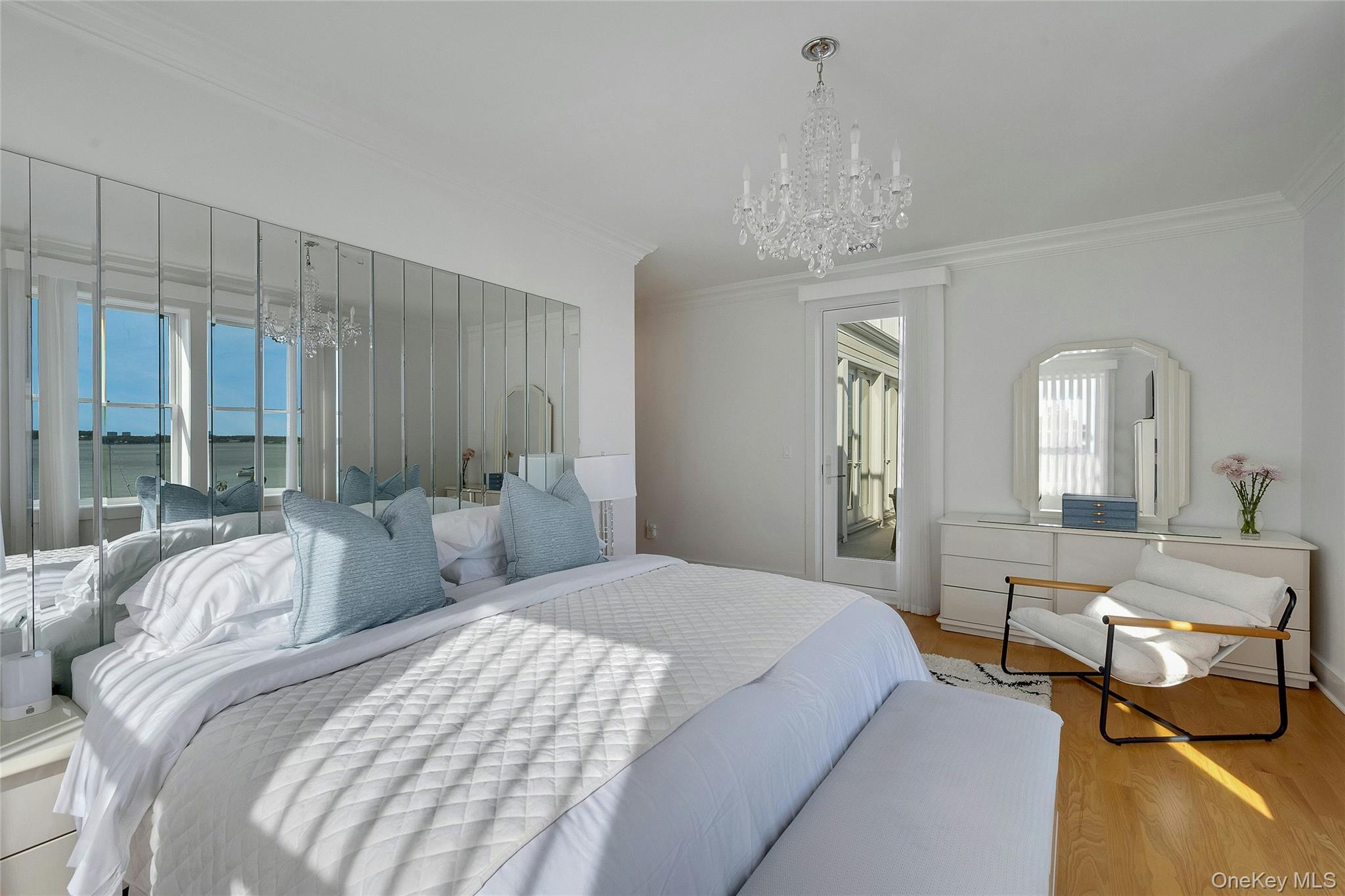 39 Island Point Bronx, NY 10464 - Photo 11 of 37 a bedroom with two beds and a chandelier