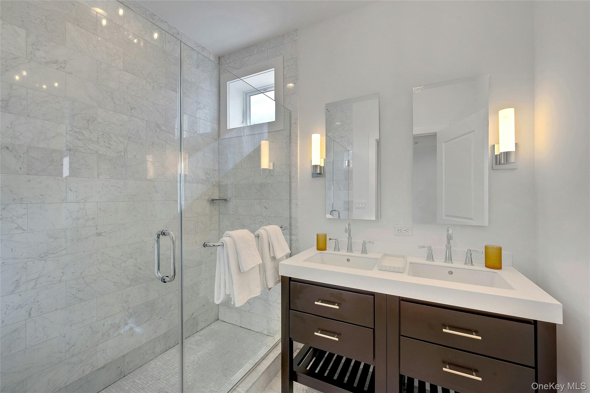 39 Island Point Bronx, NY 10464 - Photo 17 of 37 a bathroom with a double vanity sink mirror and shower