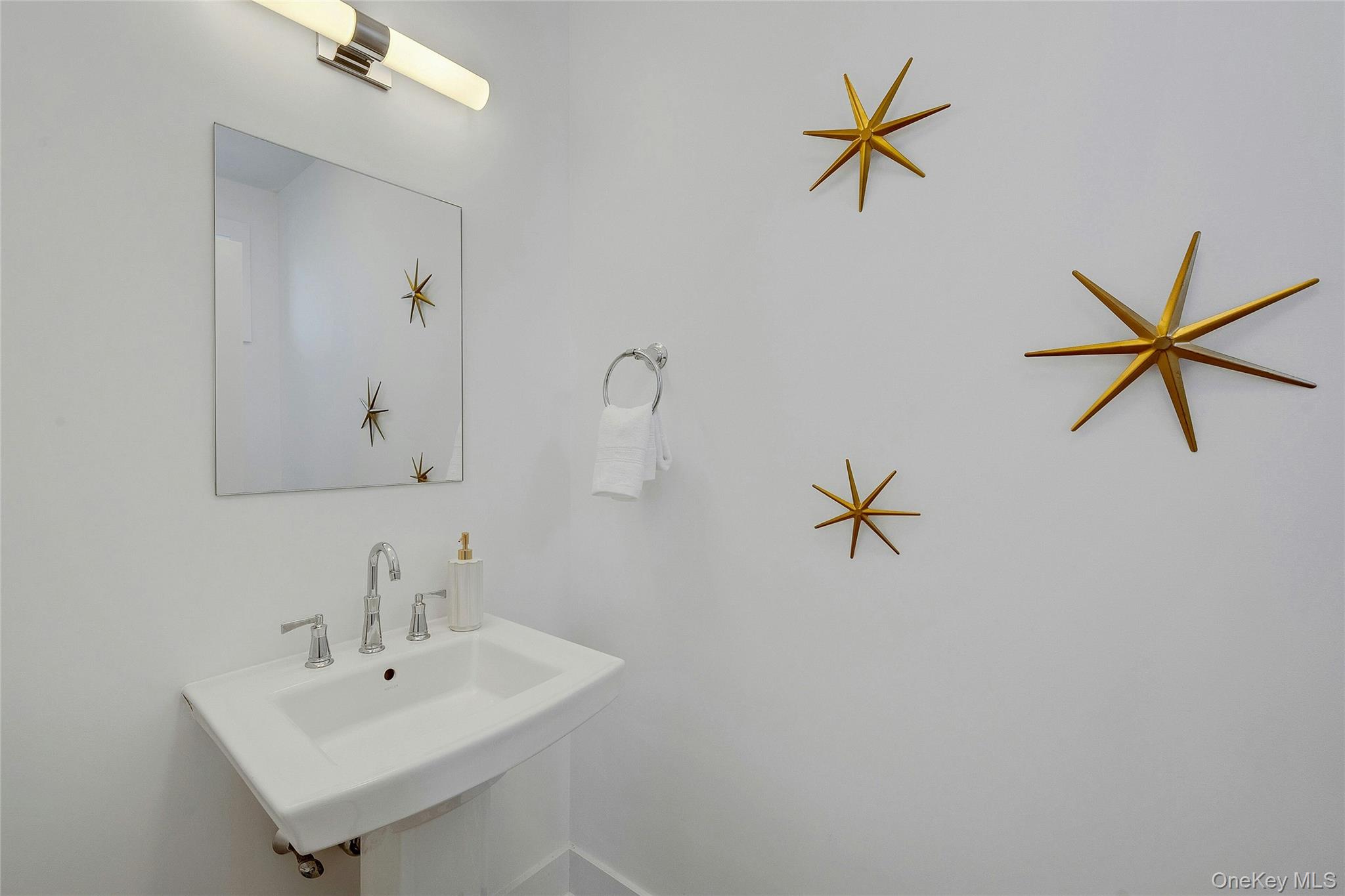 39 Island Point Bronx, NY 10464 - Photo 18 of 37 a bathroom with a sink and a mirror