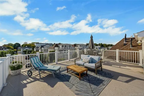 a bathroom with a sink a toilet and shower curtain