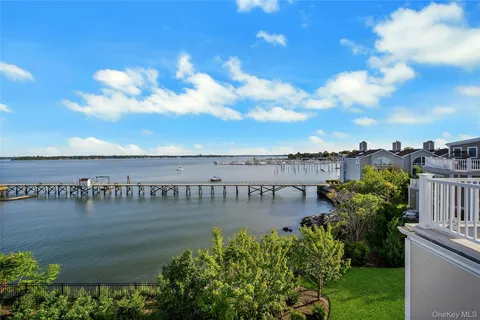 a view of a house with outdoor space and lake view