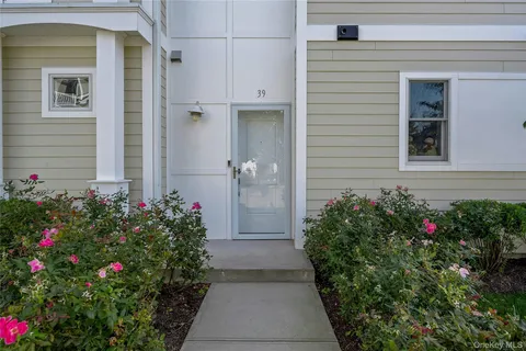 a view of a potted plant sitting in front of a house