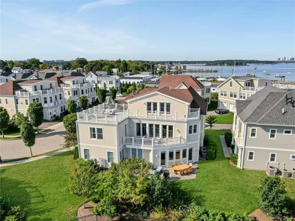 an aerial view of a house with a lake view